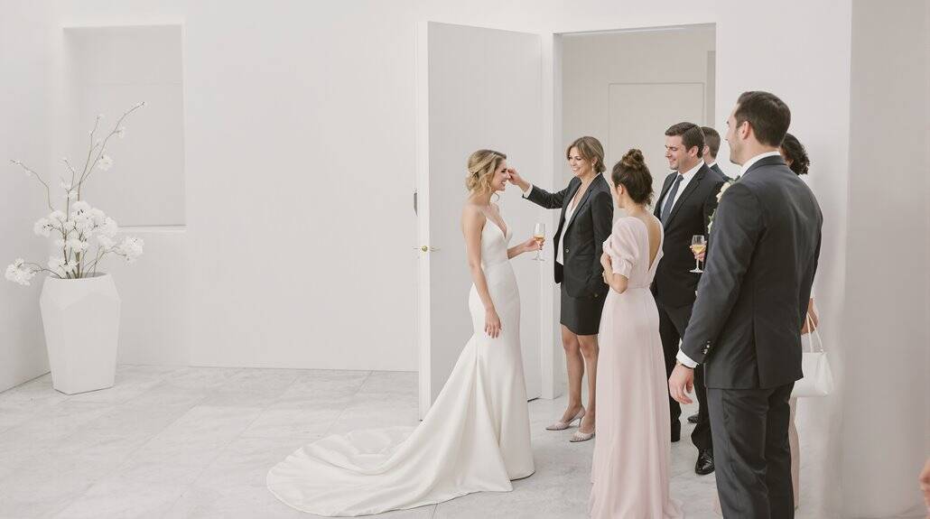 Bride and guests at elegant wedding reception in a modern, minimalist venue.