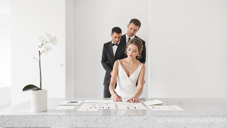 Wedding planning session with bride and groom reviewing designs and ideas.