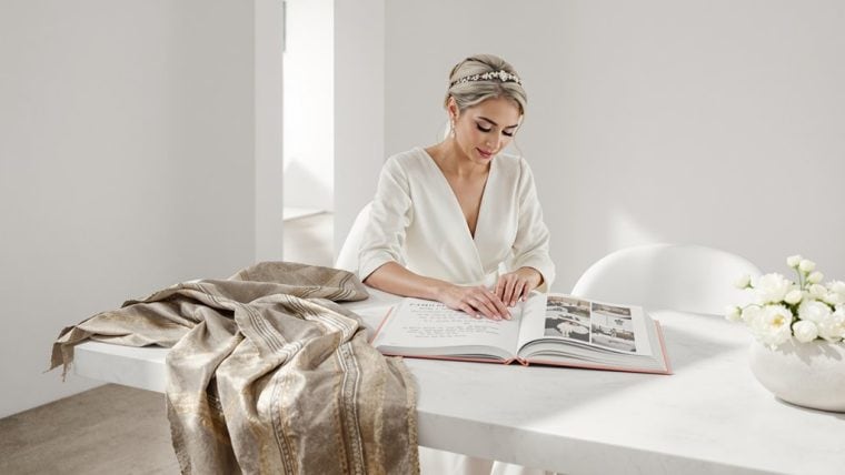 Bride reviewing wedding plans at a modern, elegant wedding setup.