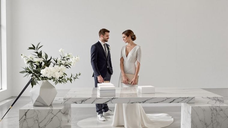Bride and groom exchanging vows at a modern wedding ceremony.
